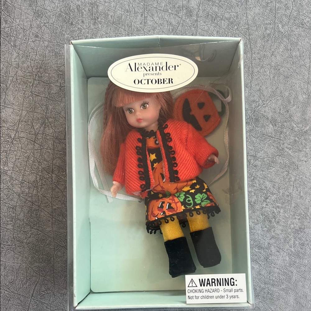 Madame Alexander Doll in Orange and Black Outfit